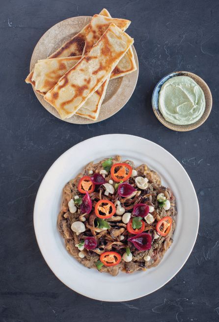Ethiopian vegetarian dulet with herbed labneh and m’semen, a North African flatbread. COOBOOK PHOTO BY CLAY WILLIAMS/COURTESY OF PENGUIN RANDOM HOUSE