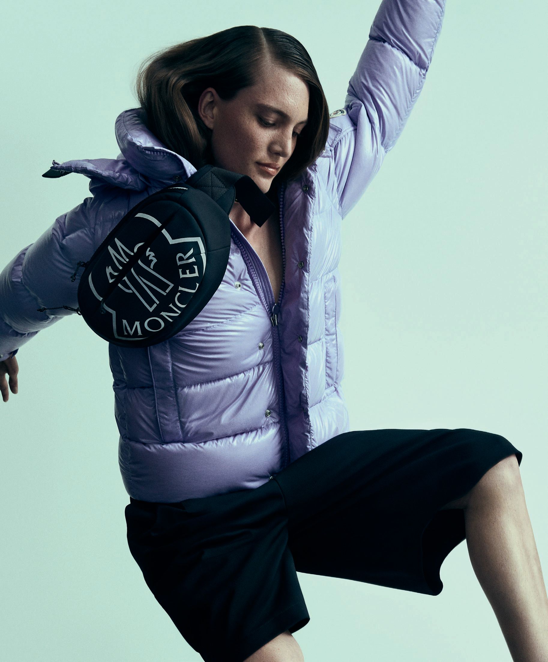 Moncler Maya 70 down jacket in Wild Lavender with nylon shorts and maxi logo nylon belt bag, moncler.com. Photographed by Yossi Michaeli Styled by Faye Power Vande Vrede