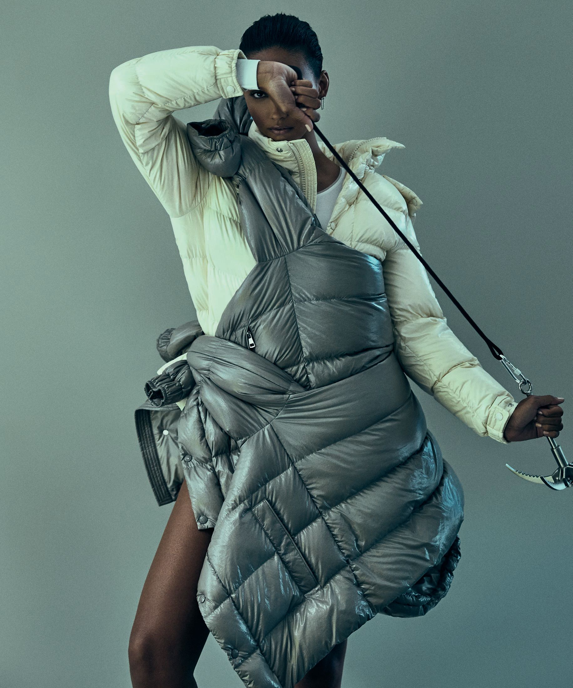 Moncler Maya 70 down jacket in Snowflake White and Basalt Gray, moncler.com. Hair by David Cruz at Tracey Mattingly Makeup by Steven Canavan using Dior Vernis at L’Atelier NYC Manicure by Jazz Style using Chanel at See Management Models: Serigne Lam, Muse Management; Cora Emmanuel, The Society Management; Izzy Wild, The Industry Model Management SET DESIGN: JULIE MILLER FOR IVY HOUSE STUDIO; SET DESIGN ASSISTANT: NICOLÁS ROMANO; PHOTO FIRST ASSISTANT: OMER KAPLAN; PHOTO ASSISTANT: BRIAN PAK-HUNG LAU
