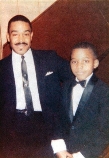 Kevin dressed up with his father. PHOTO COURTESY OF THE SHIRLEY HARRY COLLECTION