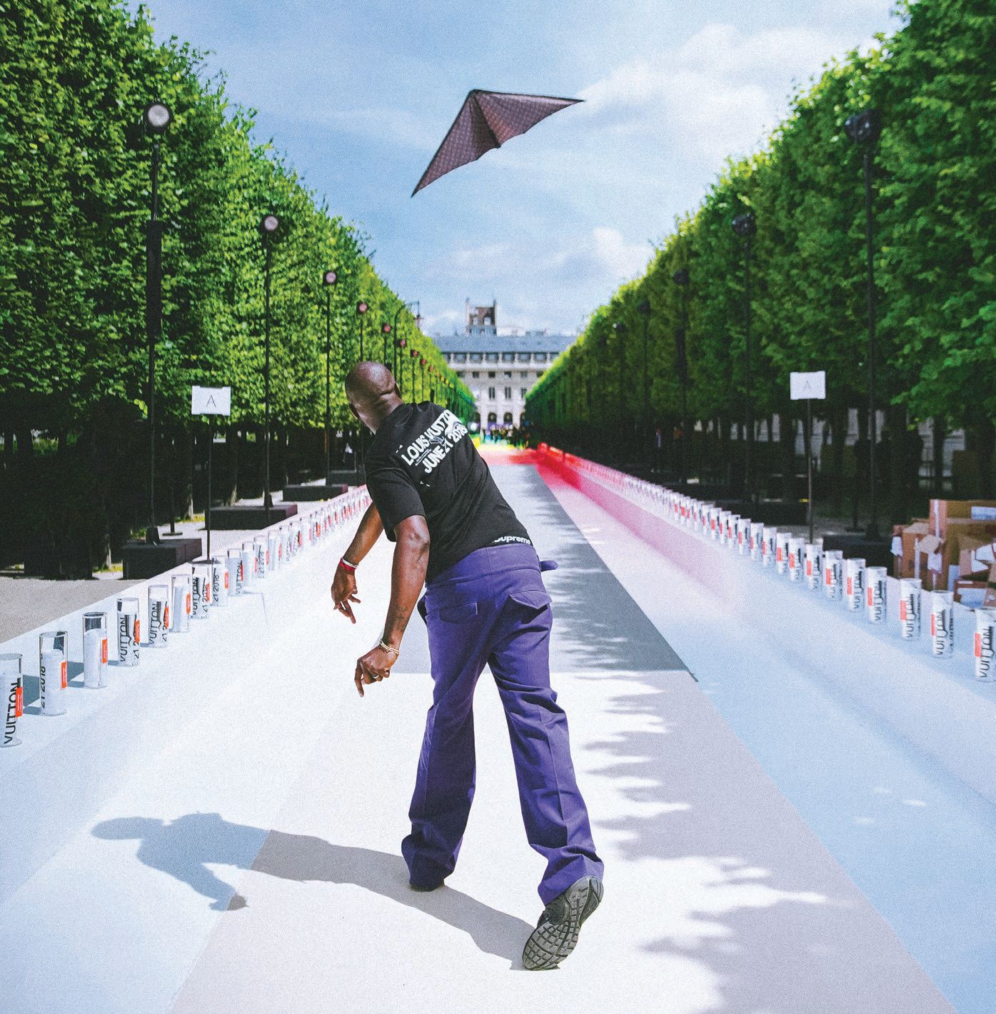 The designer launches a paper plane on the runway at his Louis Vuitton spring/summer 2019 show in Paris’ Palais-Royal garden. PHOTO: BY BOGDAN “CHILLDAYS” PLAKOV/COURTESY OF ASSOULINE
