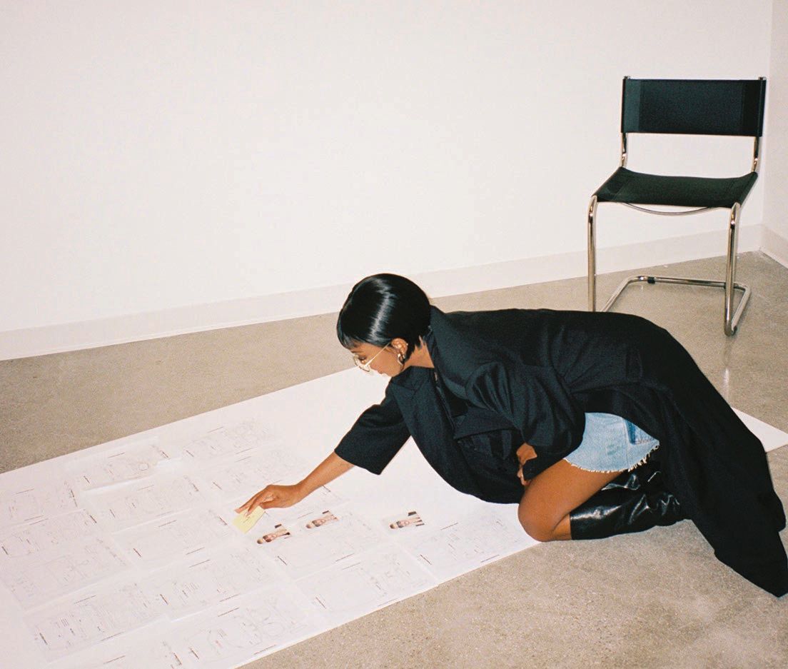 Elisa Johnson sketches her own designs for the brand PHOTO BY: MATTHEW JACKSON